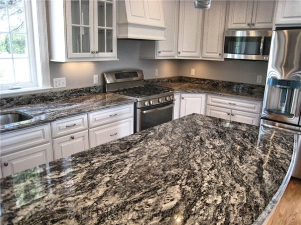 a kitchen featuring granite counter tops