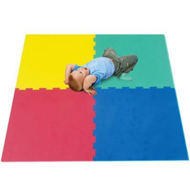 a child plays on brightly colored floor mats